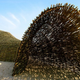 Illustration for article titled Artist creates 148-foot sandworm on the beach